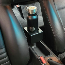 Porsche 964 / 993 cup holder mounted flush in factory center console with black water bottle