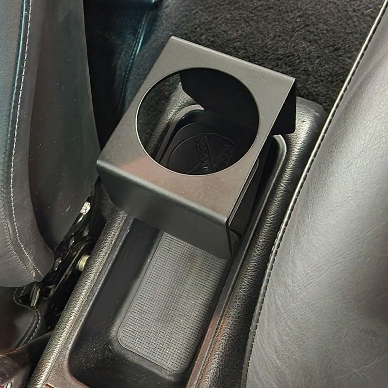 Porsche 964 / 993 cup holder installed in center console beside OEM seat rail