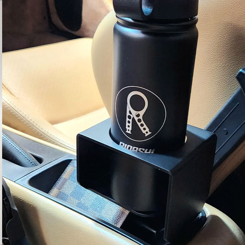 Porsche 964 / 993 cup holder holding bottle in tan factory console tray