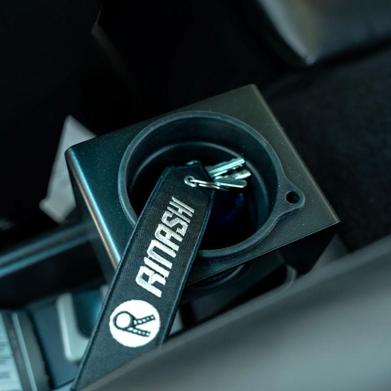 Porsche 964 / 993 cup holder slotted base — top view with keychain in factory console tray