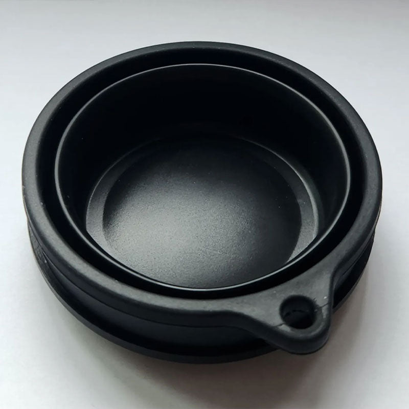 Standalone black FlexCup pocket with rounded front tab on white background