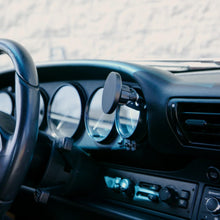 Rinashi classic 911 gauge mount phone holder installed on dashboard