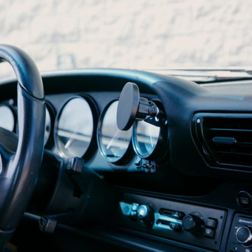 Rinashi classic 911 gauge mount phone holder installed on dashboard