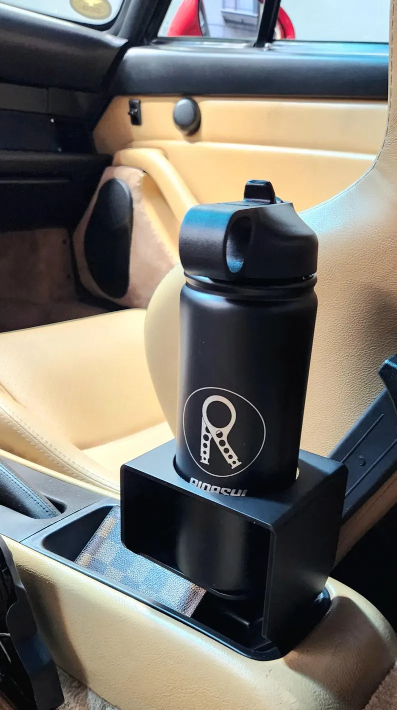 Rinashi stainless steel water bottle seated in 964/993 cup holder