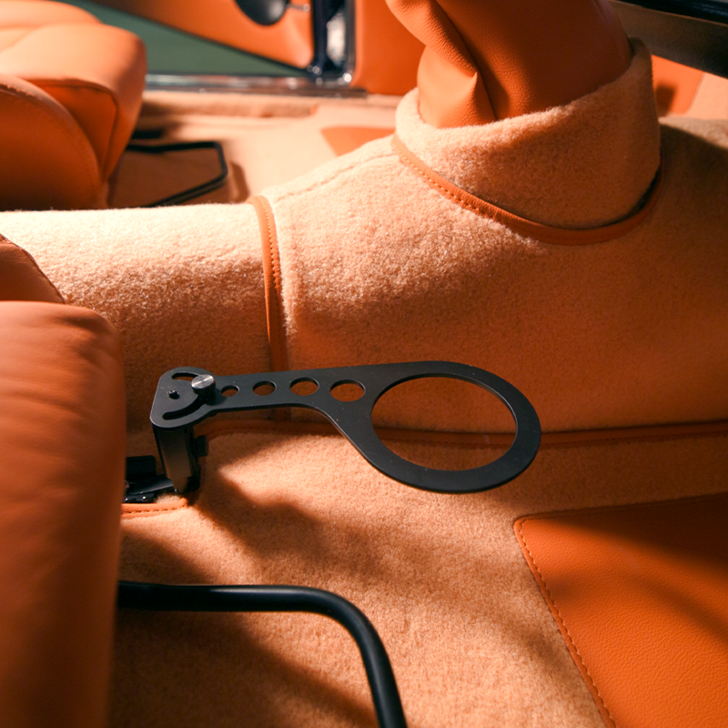 Cup holder mounted to seat rail - side view